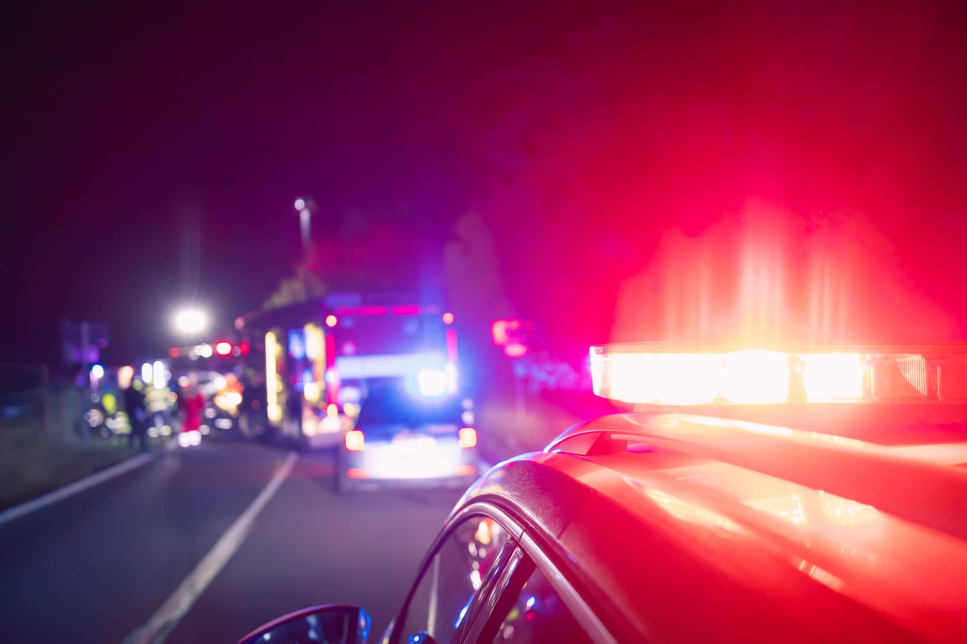 Emergency lights at a nighttime accident scene